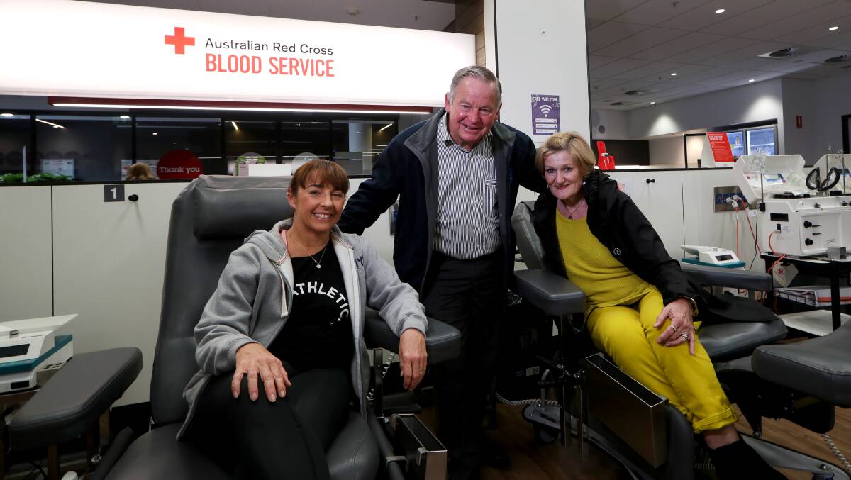 Mr Murray with supporters Lisa Kelly and his wife Gail. Picture: Sylvia Liber