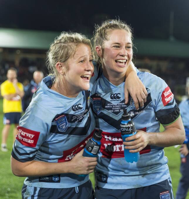 QUITE THE PAIR: Talesha Quinn and Kezie Apps celebrate the Blues State of Origin win. Picture: AAP Image
