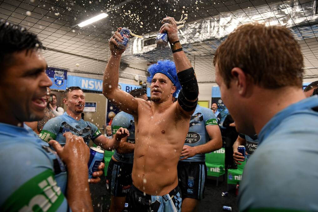 THE SPOILS: Jack de Belin celebrates the Blues series-clinching win over Queensland in Origin II at ANZ Stadium on Sunday night. Picture: AAP