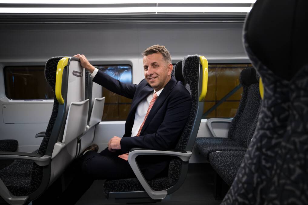 Andrew Constance, NSW Transport Minister, in a prototype of the New Intercity Fleet. The new trains will have fewer seats than those now on the line. Picture: Janie Barrett