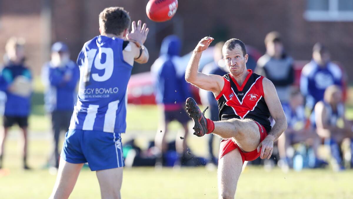 On target: Two-time Lions premiership player Josh Tier kicks a goal against Figtree at Kully Bay on Saturday. Picture: Adam McLean
