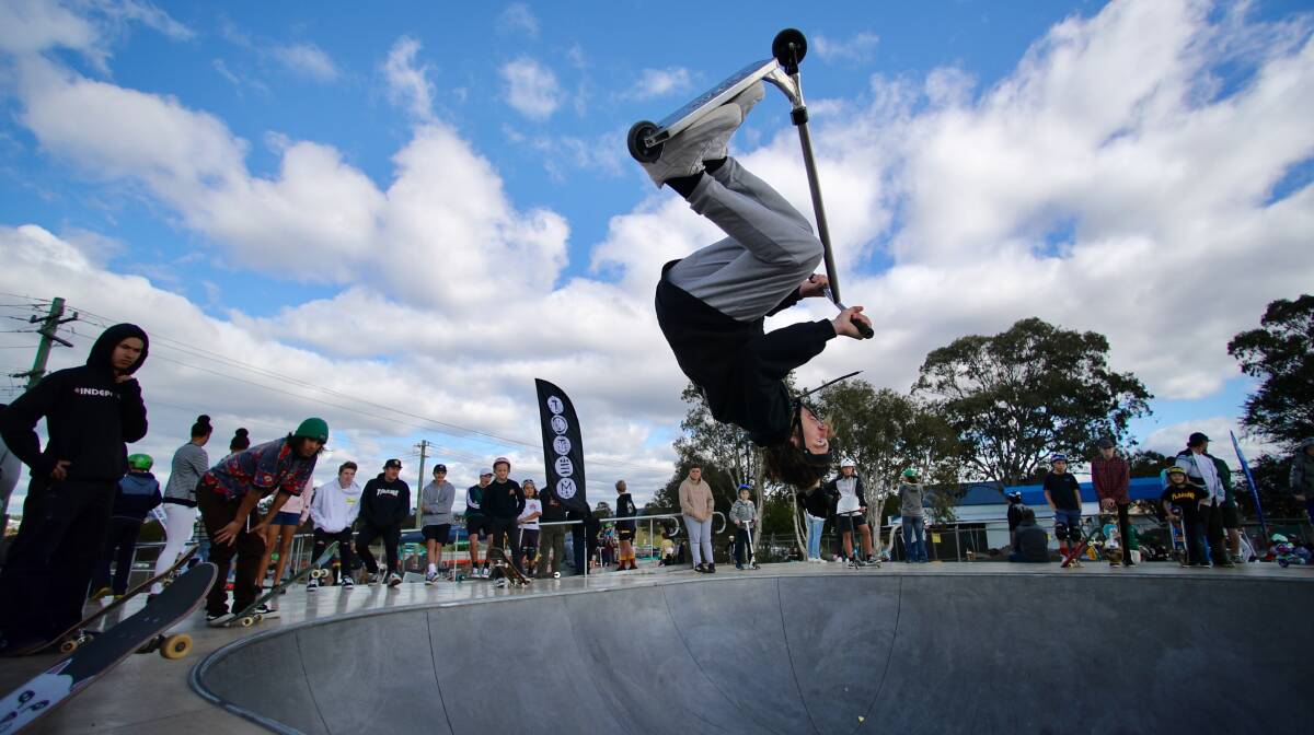 Shellharbour professional scooter rider Matt Oshea tested out the new skate park with some crowd-pleasing moves. Picture: Adam Mclean.
