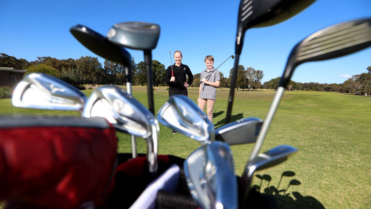 Come and try: Port Kembla Golf Club pro Katy Jarochowicz with junior Spencer Stephenson. Picture: Sylvia Liber. 