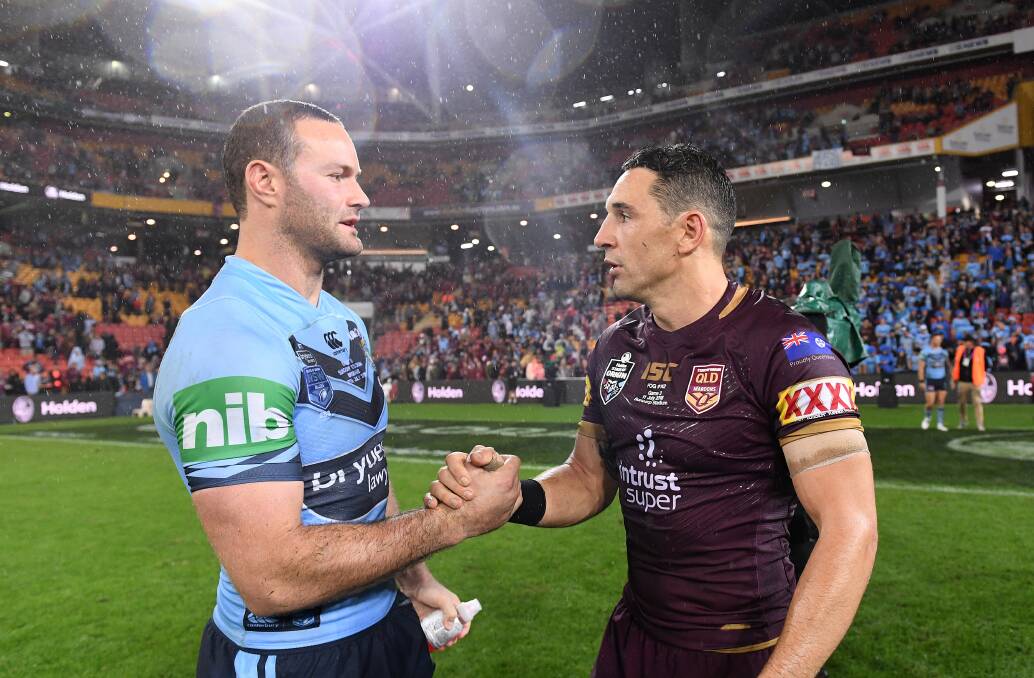 PASSING OF THE TORCH: Blues skipper Boyd Cordner congratulates Maroons captain, and Wally Lewis Medalist, Billy Slater after Origin III on Wednesday night. Picture: AAP 
