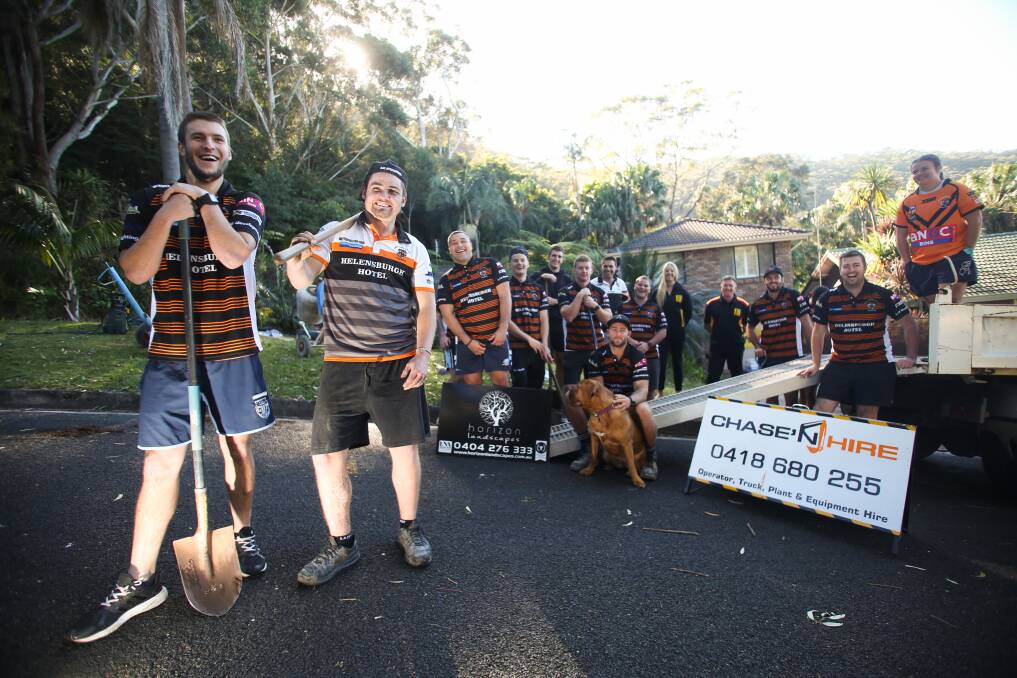 GREATEST GAME OF ALL: The Helensburgh Tigers came together last Saturday to help install essential modifications the home of their new number one fan Caleb Clark. Picture: Georgia Matts 