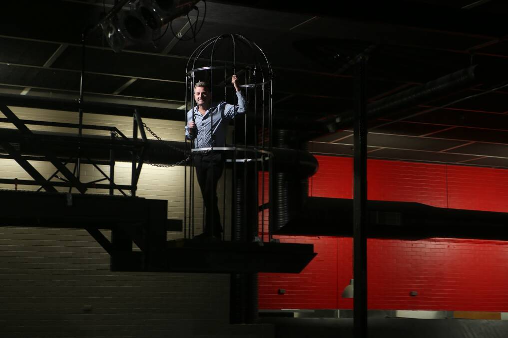 Paul Camkin standing in the go-go birdcage at Waves. Picture: Sylvia Liber