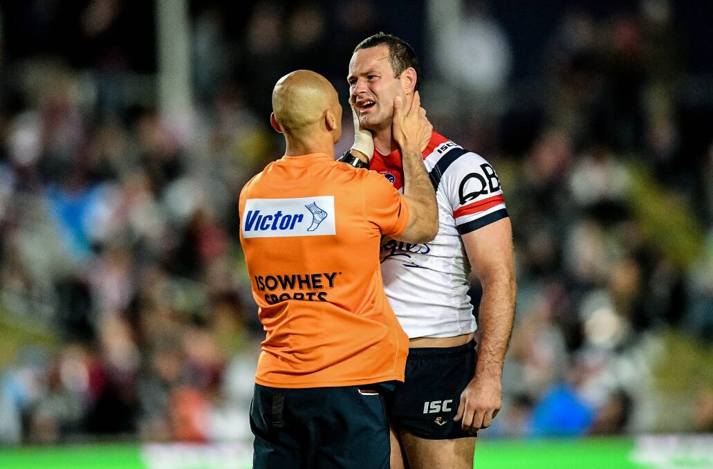 Pain barrier: Boyd Cordner is treated for a shoulder and neck injury. Picture: AAP Image/Brendan Esposito