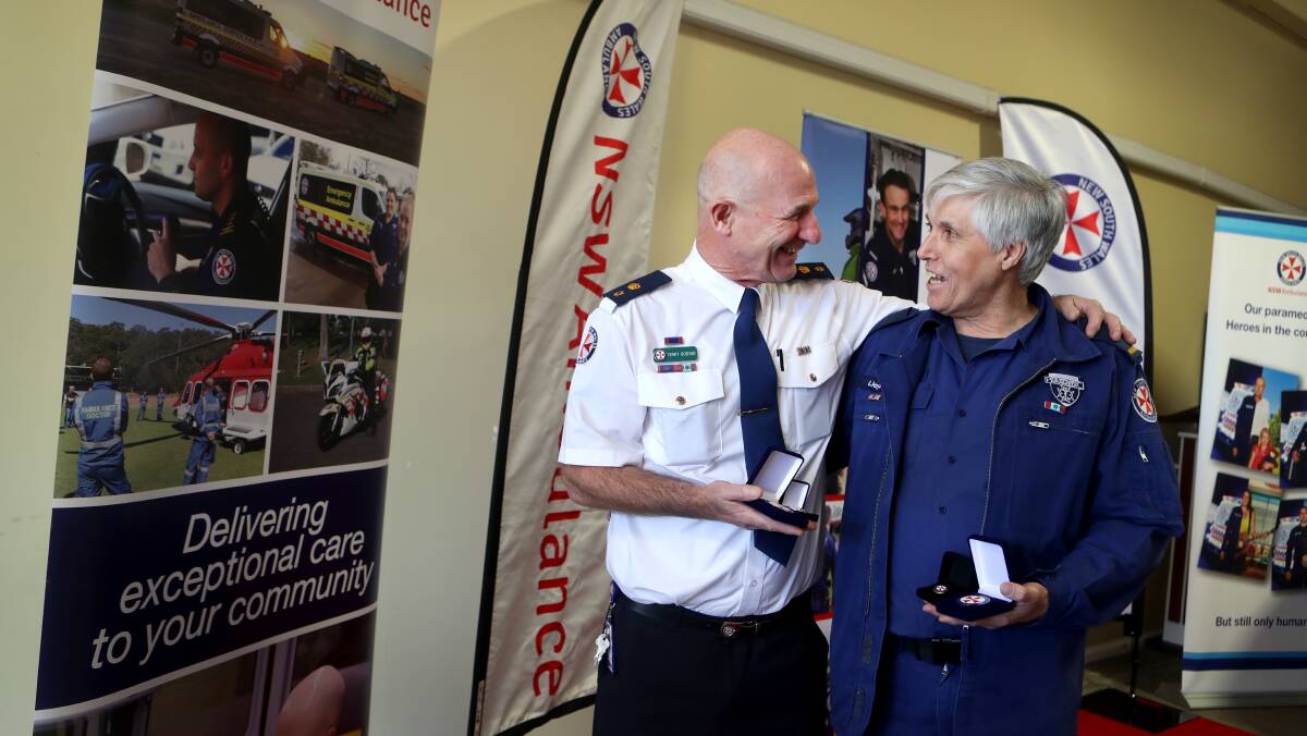 Long service: Illawarra ambulance officers Terry Goding and Lloyd Chatfield were presented with recognition of service medals on Monday. Picture: Sylvia Liber