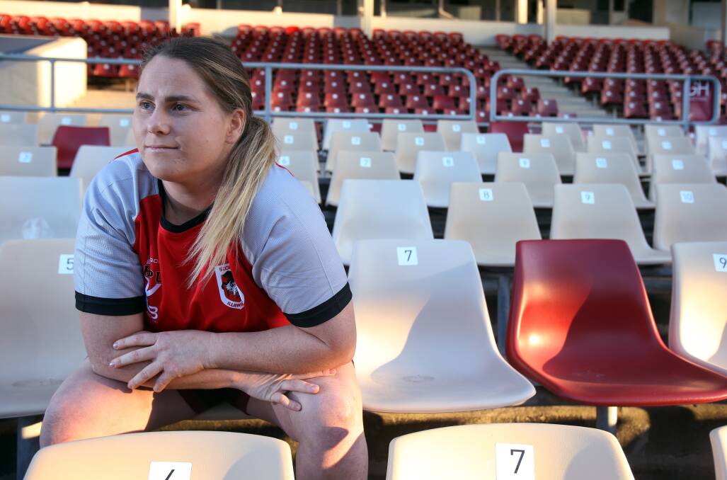 NEVER GONE: "He's never seen me score a try or win a premiership but he's always with me." Georgie Brooker reflects on the influence of her father Andrew after signing her contract with the Dragons this week. Picture: Robert Peet