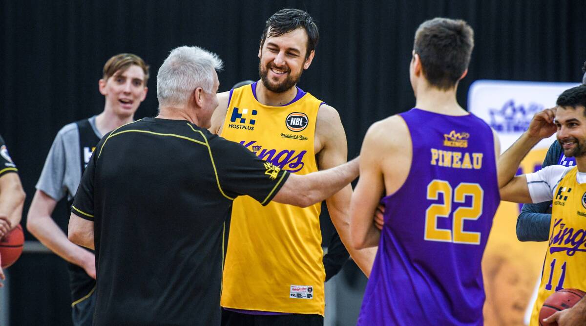 Laughing matter: Sydney Kings' Andrew Bogut talks tactics with coach Andrew Gaze. Picture: AAP Image/Brendan Esposito