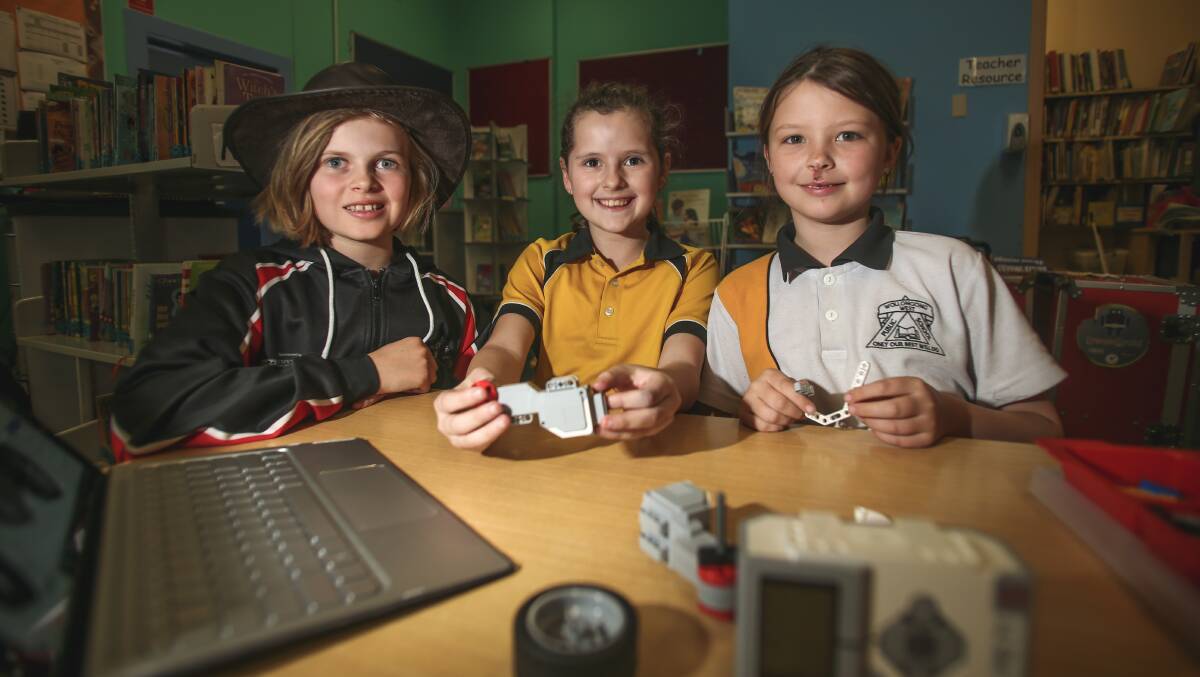 GIRLS ONLY: Team leader Cara Sims with students Teagan Sallans and Temple Atkinson taking part in the Rocketing Girls into Robotics program. Picture: Georgia Matts 