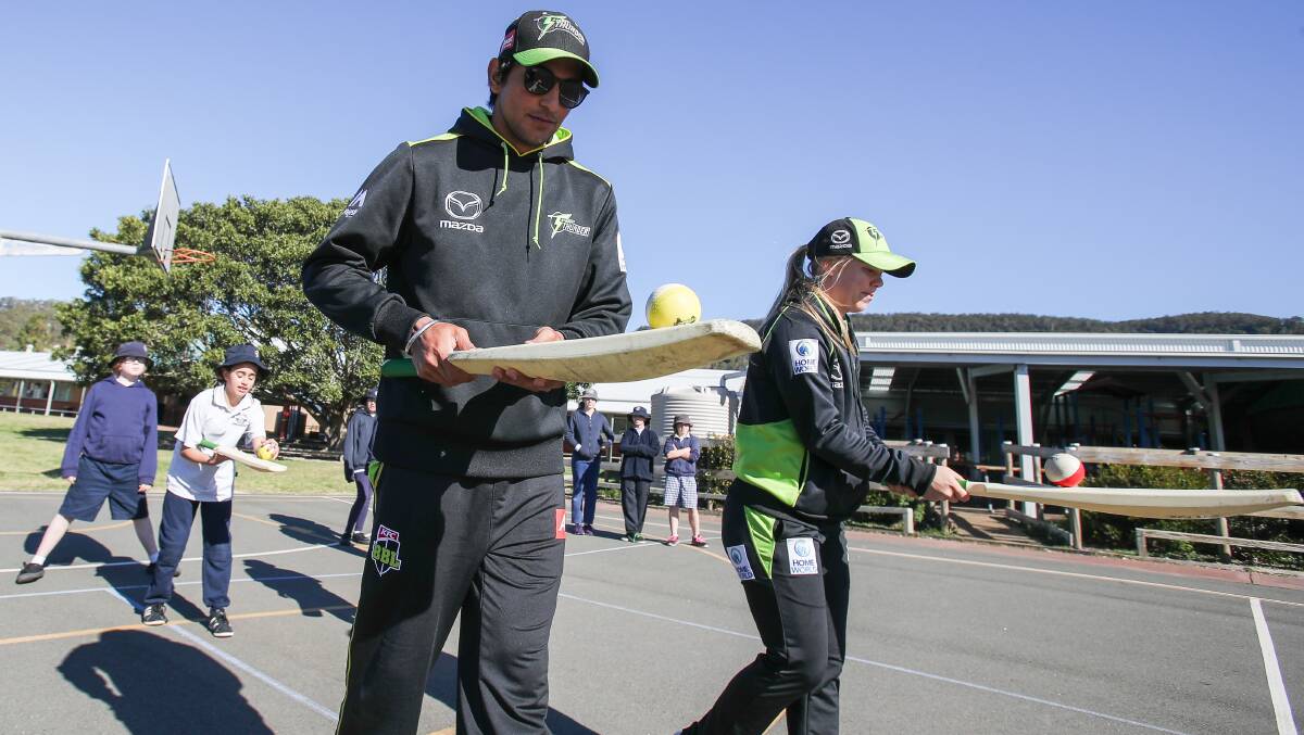 Eye on the prize: Jason Sangha and Naomi Stalenberg run students from Mt Terry Public School through a cricket drill. Picture: Adam McLean