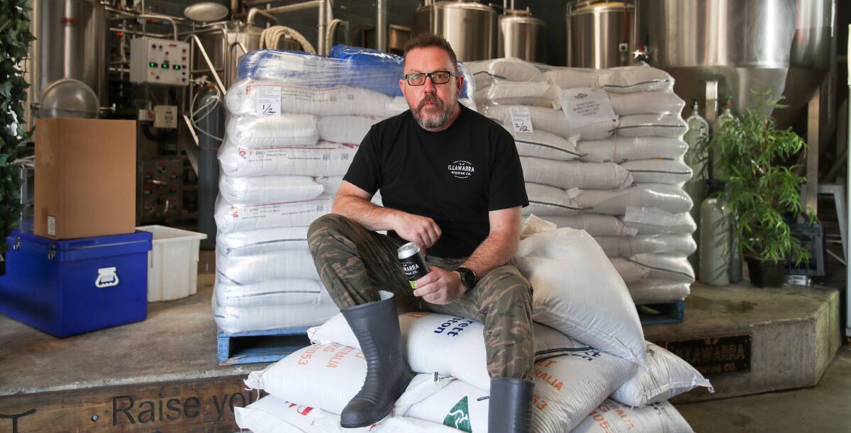 PADDOCK TO BOTTLE TO PADDOCK: David McGrath from Illawarra Brewing Company with some bags of grain which will be sent to farmers after they are cooked. Picture: ADAM McLEAN.