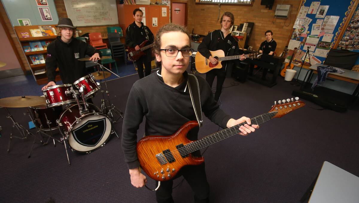 ROCKING OUT: Southern Stars performers Hayden Markham-Ball, Leon Holstegge, Aden Spencer, Kye Meizer and Caleb Morice during rehearsals. Picture: Robert Peet