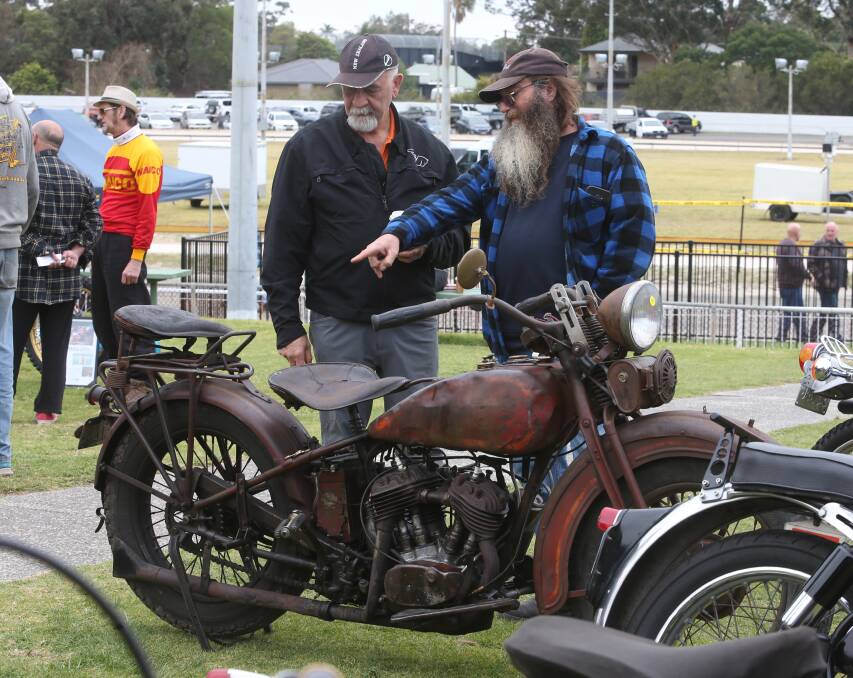 Rustic and real: Tony Hirini and Waza Sturdy looking at a vintage Harley Davidson showing all the charm of the machines from last century.
