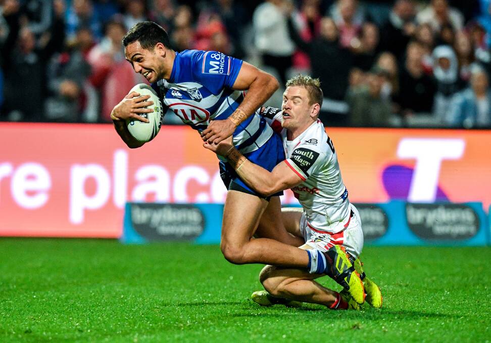TOUGH NIGHT: Matt Dufty in action against the Bulldogs. Picture: AAP