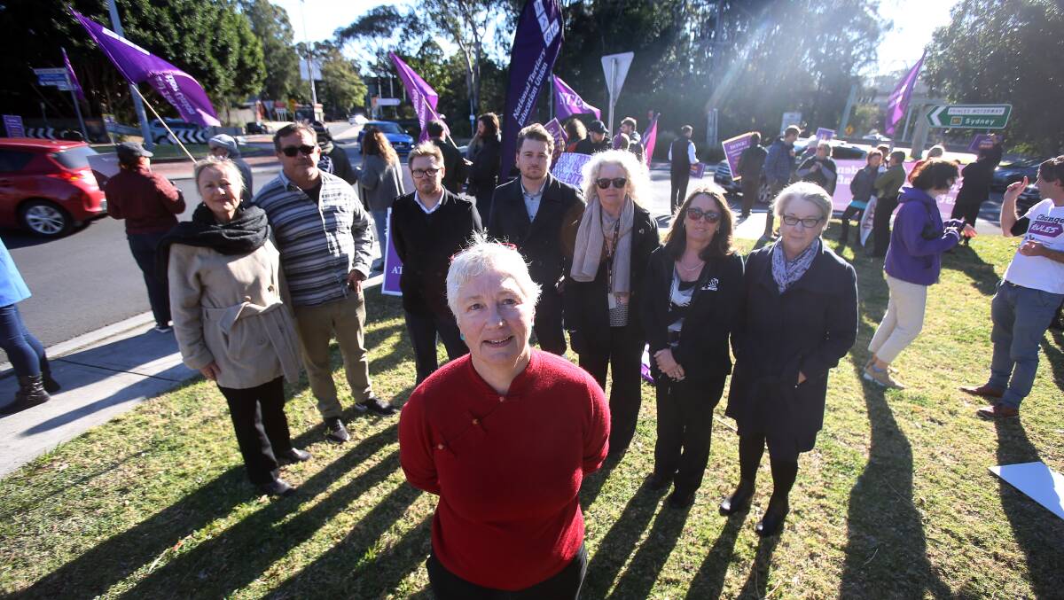 RALLYING FOR SECURE JOBS: Associate Professor Georgine Clarsen, the UOW branch president for NTEU, with supporters at the Wollongong rally. Picture: Robert Peet