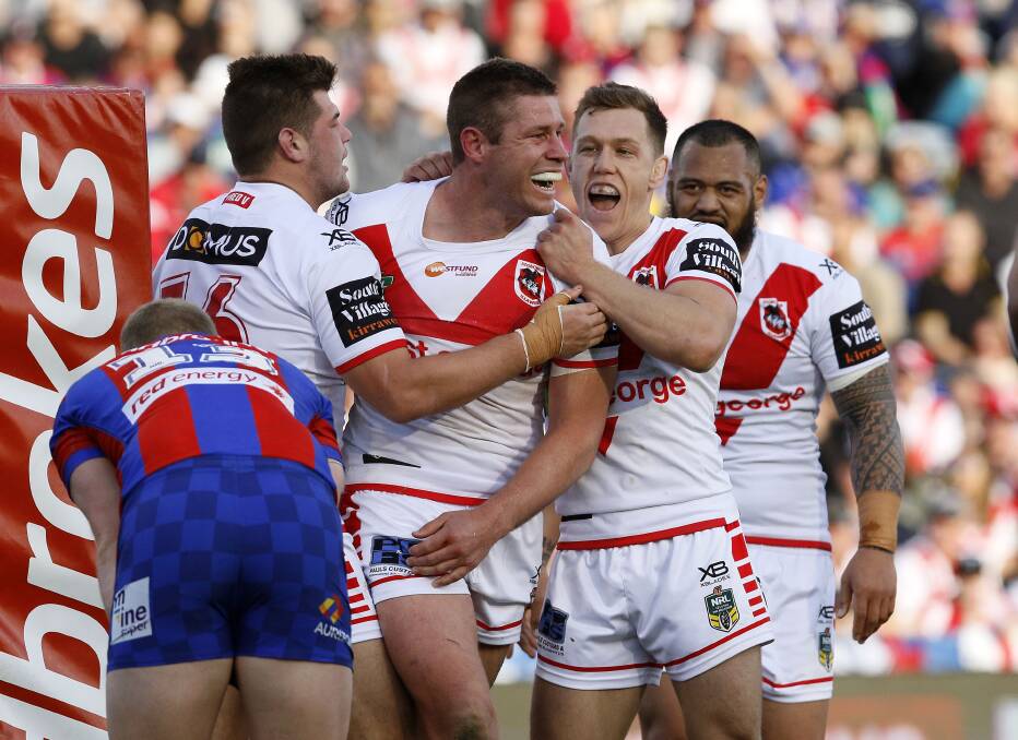 NICE: Dragons players celebrate Jeremy Latimore's try in their win over Newcastle on Saturday. Picture: AAP
