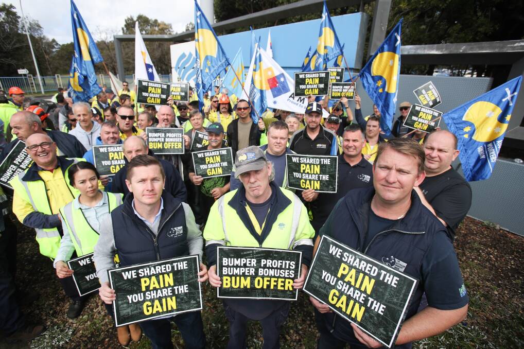 Pay rise: Australian Workers Union national secretary Daniel Walton (left), steelworker Lance Turner and AWU senior vice president Paul Farrow at the gates of the Port Kembla steelworks with striking workers. Picture: Adam McLean