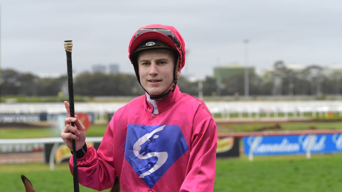 HAPPY DAYS: Jockey Sam Weatherley reacts as he returns to scale after riding Mandylion to victory in the Canadian Club Handicap. Picture: AAP Image/Simon Bullard