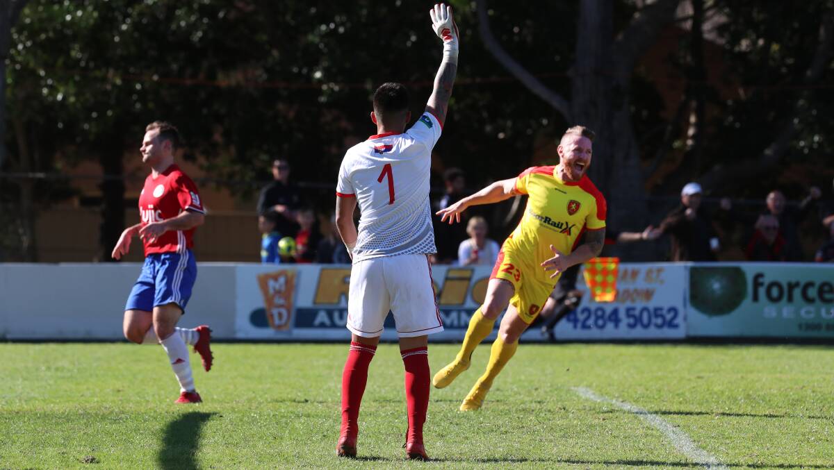 ON TARGET: Wollongong United striker Matthew McNab celebrates the club's opening goal against Albion Park. Picture: ADAM McLEAN