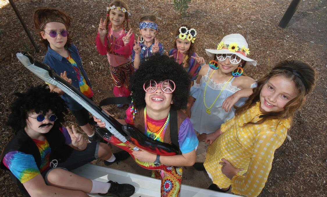 MERC, NEWS, BALARANG PUBLIC SCHOOL Pic taken 14th September 2018 of clockwise from centre, Balarang Public School students Bryn Evans, Beau Ritchie, Jack Ritchie, Taleah Knowles, Avery Griffiths, Alanna Macey, Larissa Treveana and Indya Smith. RE, Students dressed in 60's period outfits celebrating the school's 50th anniversary. Picture: Robert Peet