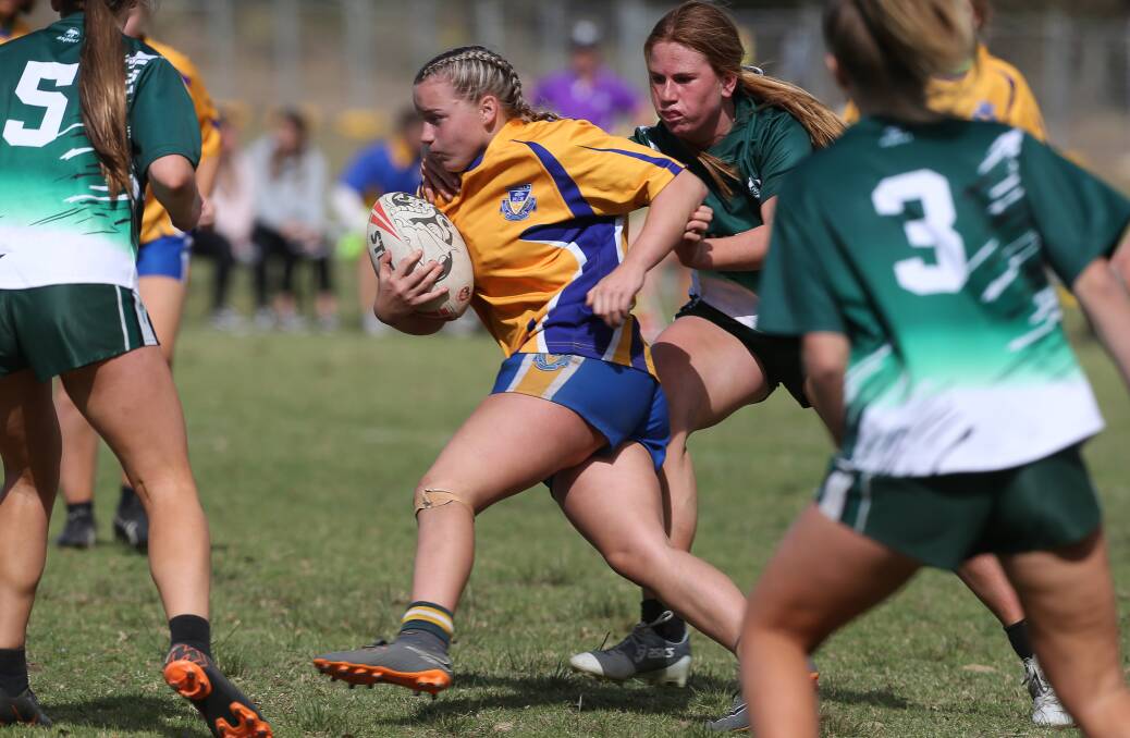 Charging forward: Warilla's Mackenzie Lear runs with the ball during the Sam Bremner Shield on Tuesday. Picture: Robert Peet.