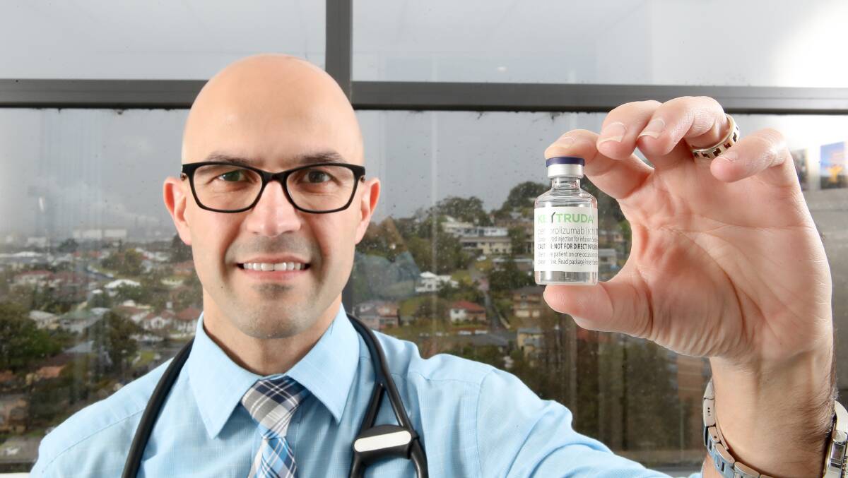 Gamechanging: Associate Professor Ali Tafreshi in his rooms at Wollongong Private Hospital with a vial of the drug Keytruda that he's using in trials for lung cancer patients. Picture: Adam McLean
