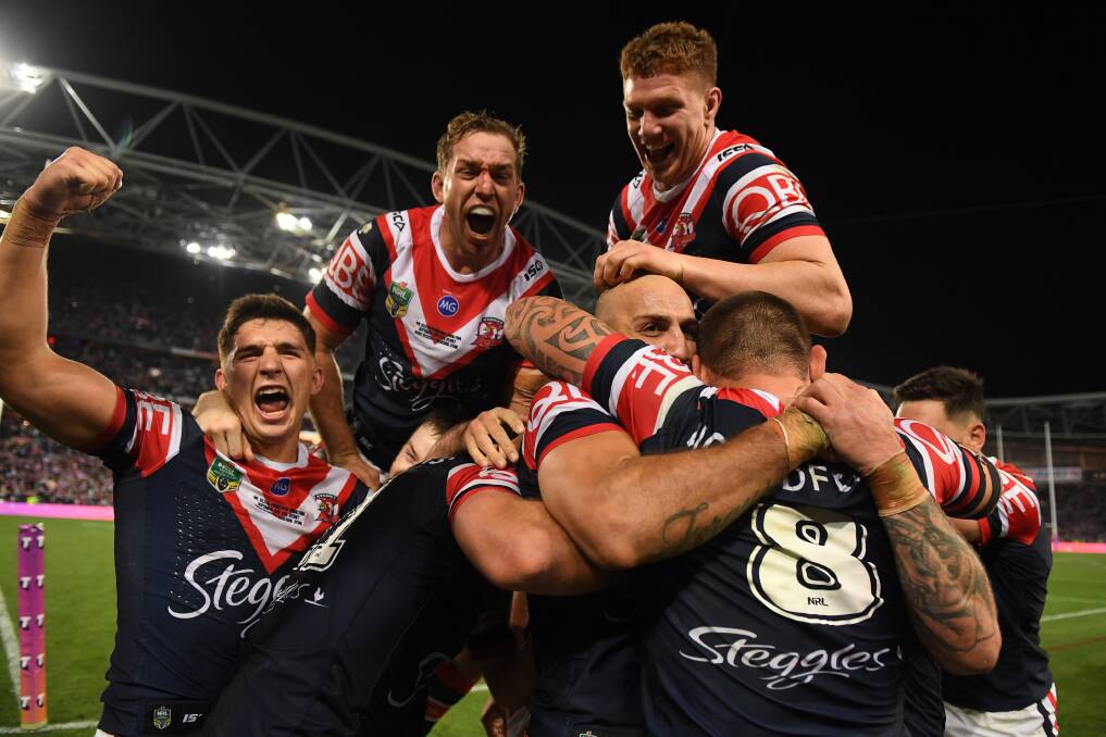 CHAMPIONS: The Roosters celebrate their grand final victory. Picture: AAP 