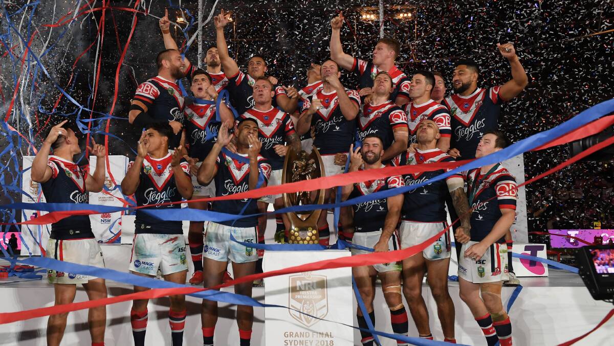 Victorious: The Sydney Roosters celebrate their grand final victory. Picture: AAP Image/Dean Lewins.