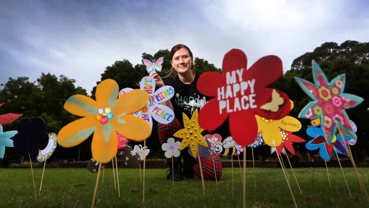 Field of flowers: TAFE student Kathryn Fitzpatrick hopes community members will join in the celebrations at MacCabe Park. Picture: Sylvia Liber