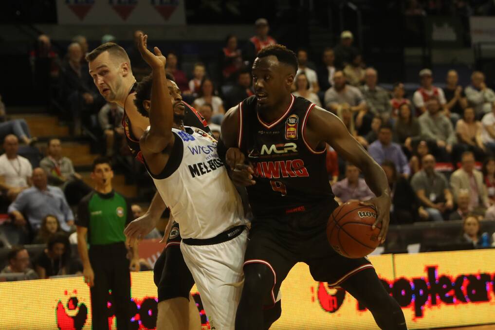 REMATCH: Casper Ware and Cedric Jackson go at it in the Hawks round-one quadruple overtime loss to Melbourne. Picture: Sylvia Liber