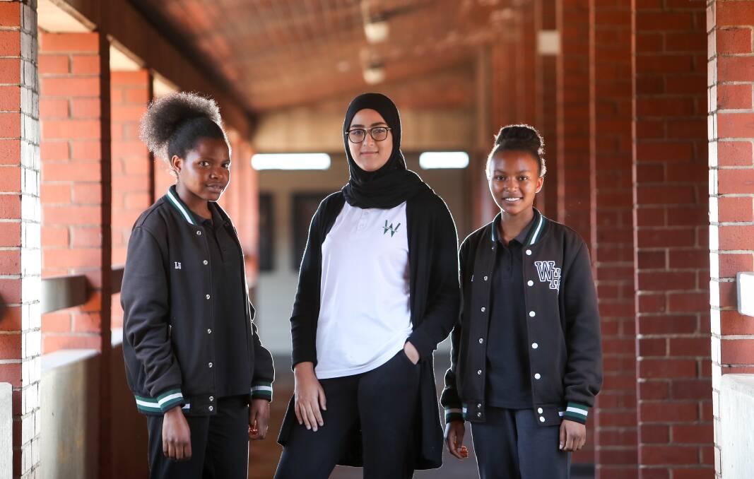 Warrawong High students Leatitie Umuvyeyi, Razan Al Wadi and Radieuse 'Clara' Ncuti. Photo: Adam McLean