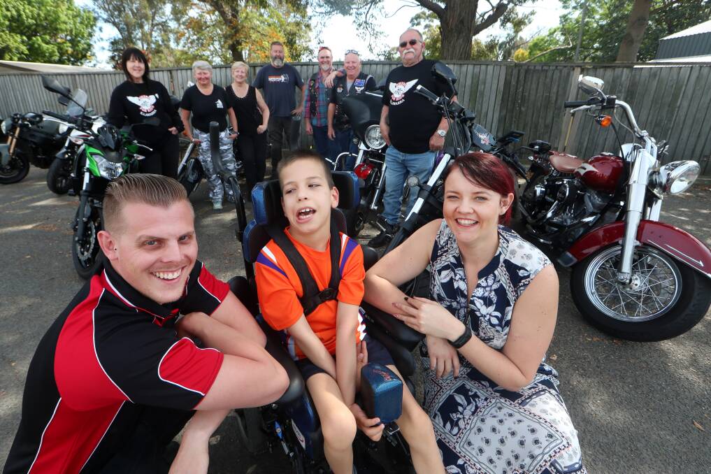 Barrack Heights boy Dane Robinson with KidzWish supporters Josh Rowles and Chanise Bathis (front) with (back left to right) Sharron Gardener, Debra Morrison, Ramona Moon, Russell Gibson, Charly Green, Wayne Kelly and Bob Willett. Picture: Sylvia Liber