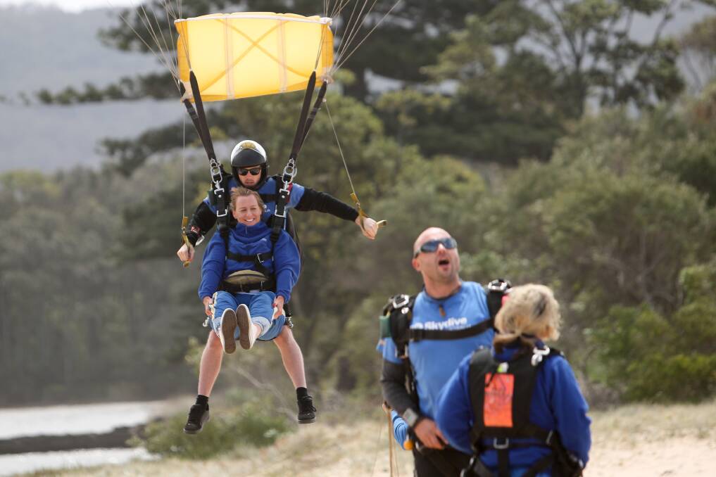 Senior Constable Hayley Hopson skydiving onto North Wollongong beach on Sunday. Picture: Adam McLean