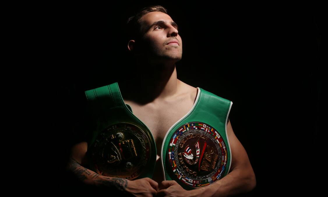 Success: Dave Pennimpede with his WBC Oceania light-heavyweight title belts. Picture: Robert Peet