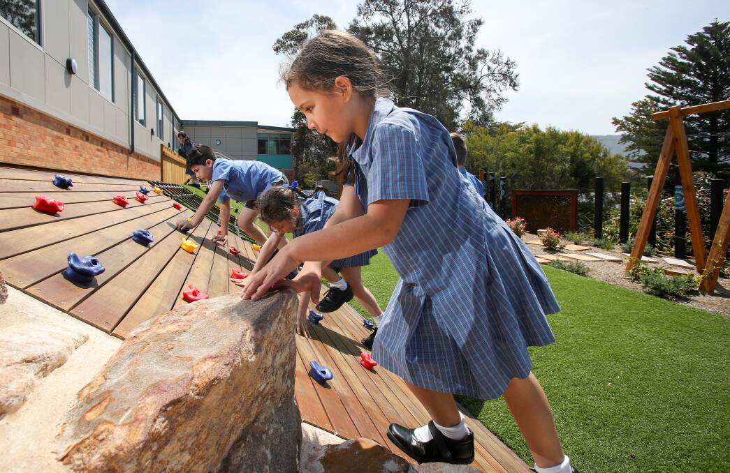 GREAT FUN  St Joseph's Catholic Parish Primary School students playing in the new adventure playground. Picture: Adam McLean