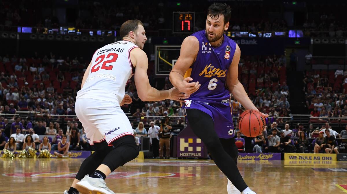 DOUBLE HEADER: Kings forward Andrew Bogut is pressured by Illawarra's Tim Coenraad during the Round 4 match. Picture: AAP Image/Dean Lewins