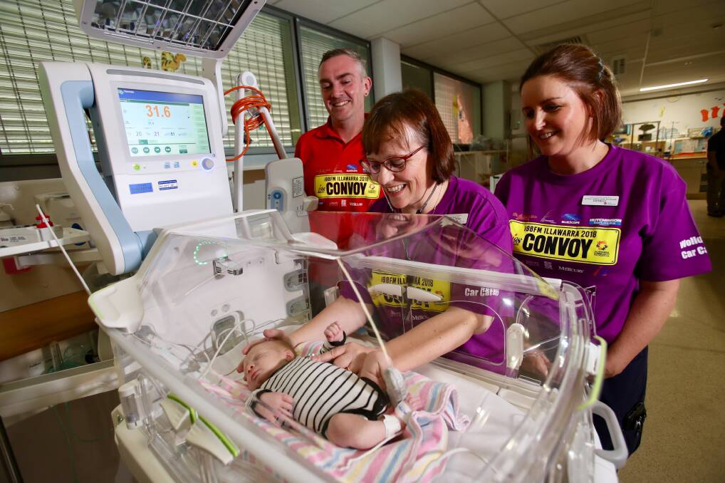 Donation: Convoy's Mark Rigby with Wollongong Hospital's Dr Susie Piper and Danielle Coggan and baby Elijah Martin in the new humidicrib. Picture: Adam McLean. 