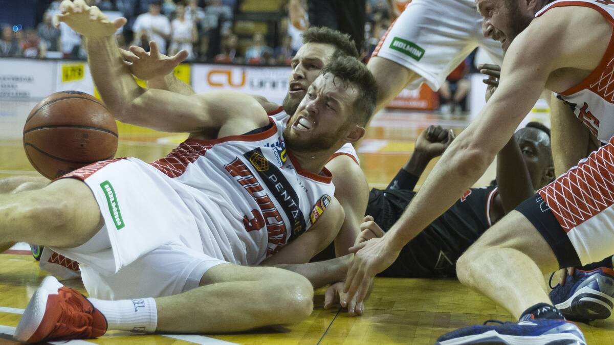 EFFORT PLAY: Perth forward Nick Kay of the Wildcat battles for possession on the deck as the Wildcats beat the Illawarra Hawks. Picture: AAP Image/Craig Golding
