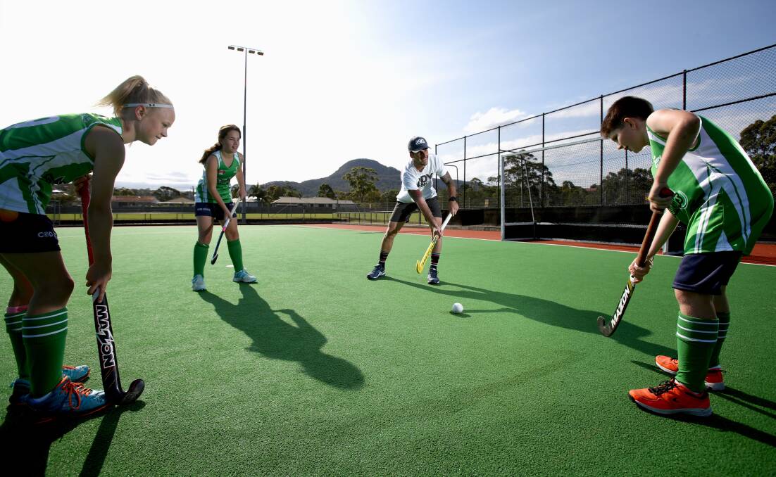 Look to the future: Kieran Govers during a coaching clinic with (from left) Heidi Wright, Charlee Buckman and Thomas Frew at the Illawarra Hockey Centre this week. Picture: Adam McLean