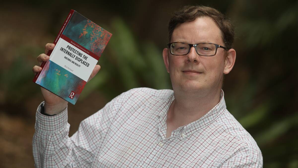 REFUGEE ADVOCATE: Phil Orchard's book called Protecting The Internally Displaced, is exactly what the UOW professor would like to see all countries do more of in the nyears to come. Picture: Robert Peet