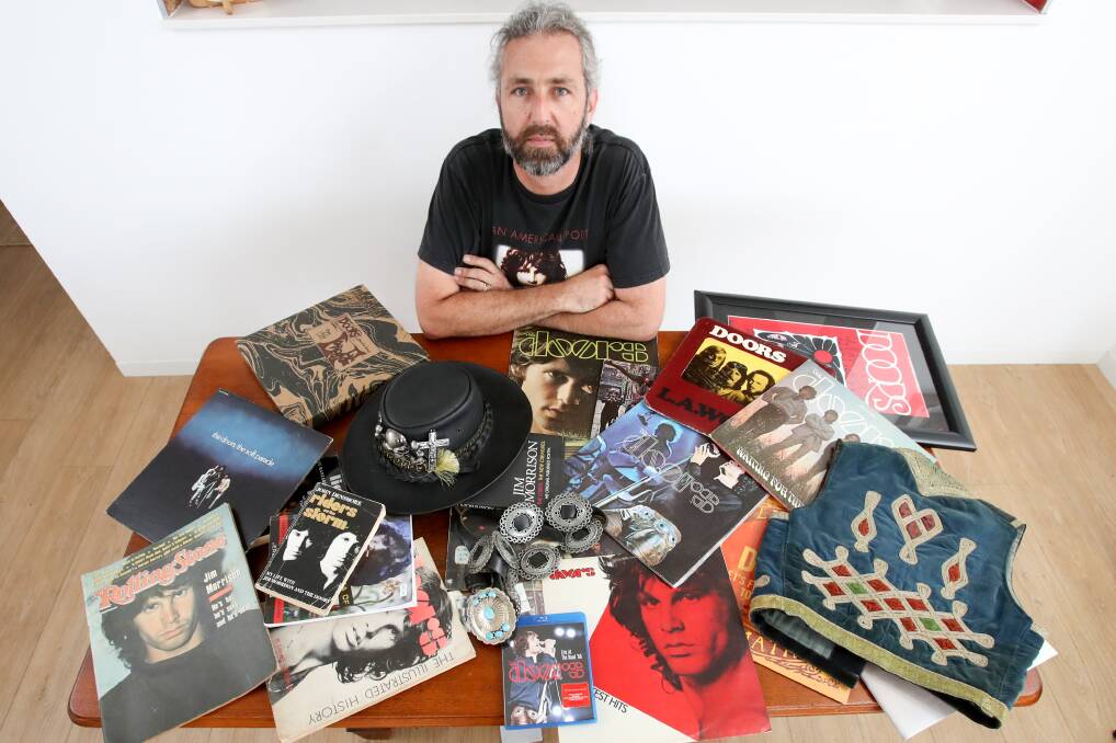 Illawarra's biggest Jim Morrison fan Rich Mikic with some of his memorabilia. His tribute band Unlocking The Doors will play a tribute gig on Saturday in Thirroul, for what would have been Morrison's 75th birthday. Picture: Adam McLean