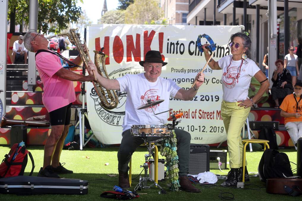 GROOVY: Wollongong Lord Mayor Gordon Bradbery throws his support behind the not-for-profit community festival Honk! Oz on Friday with Garry Hoban and Sue Bonner, a festival ‘all about participation’. Picture: Robert Peet