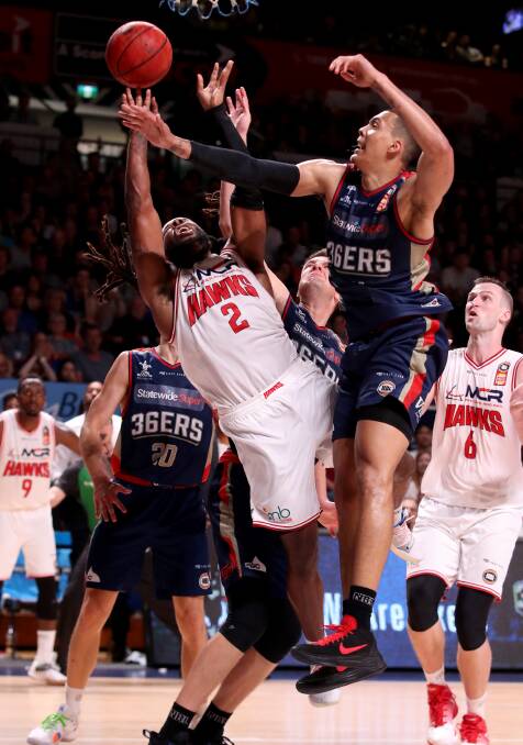 BUZZER BEATER: Jordair Jett makes his final successful drive to the hoop in the Hawks last-gasp win over Adelaide on Sunday. Picture: AAP