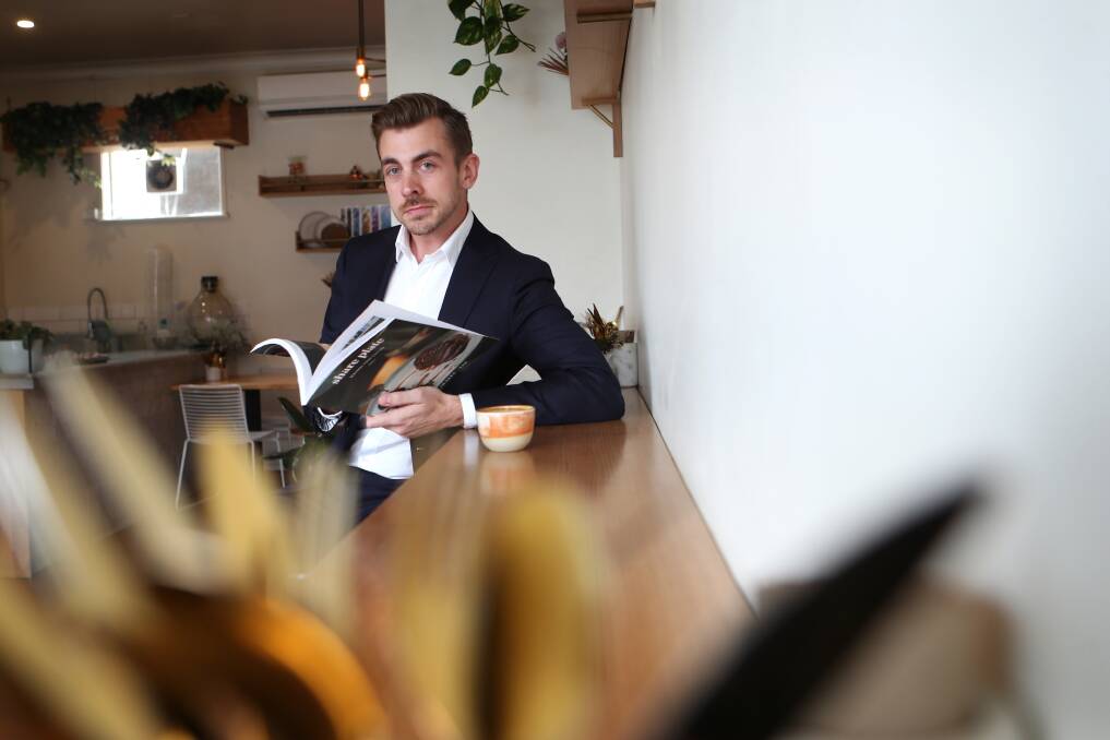 NEW VENTURE: Share Plate publisher Mitchell Crowle at one of his favourite Wollongong haunts, Opus cafe. Picture: Sylvia Liber