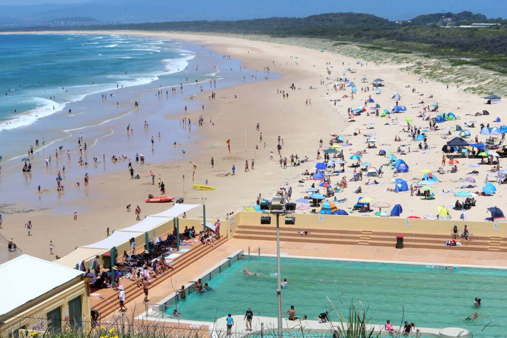 KEEP IT COOL: Crowds flocked to Port Kembla beach and pool for New Year's Day this year - as they will again on Saturday. Picture: SYLVIA LIBER.