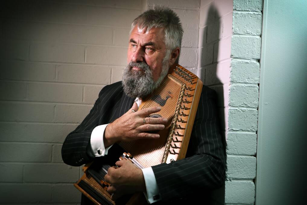 NEVER TOO OLD: Wollongong lawyer Graeme Morrison says while it's easier to learn an instrument as a child, one is never too old to give it a go. He first picked up the auto-harp when he was around 57. Picture: Sylvia Liber