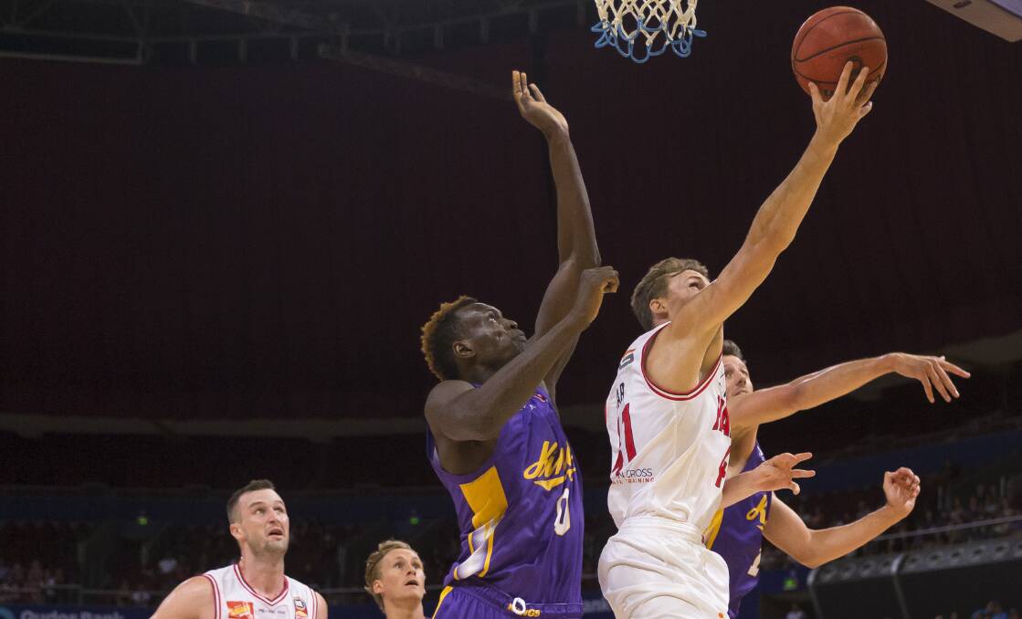 ON FIRE: Hawks guard Emmett Naar drives to the basket in Illawarra's win over Sydney Kings at Qudos Bank Arena. Picture: AAP Image/Craig Golding
