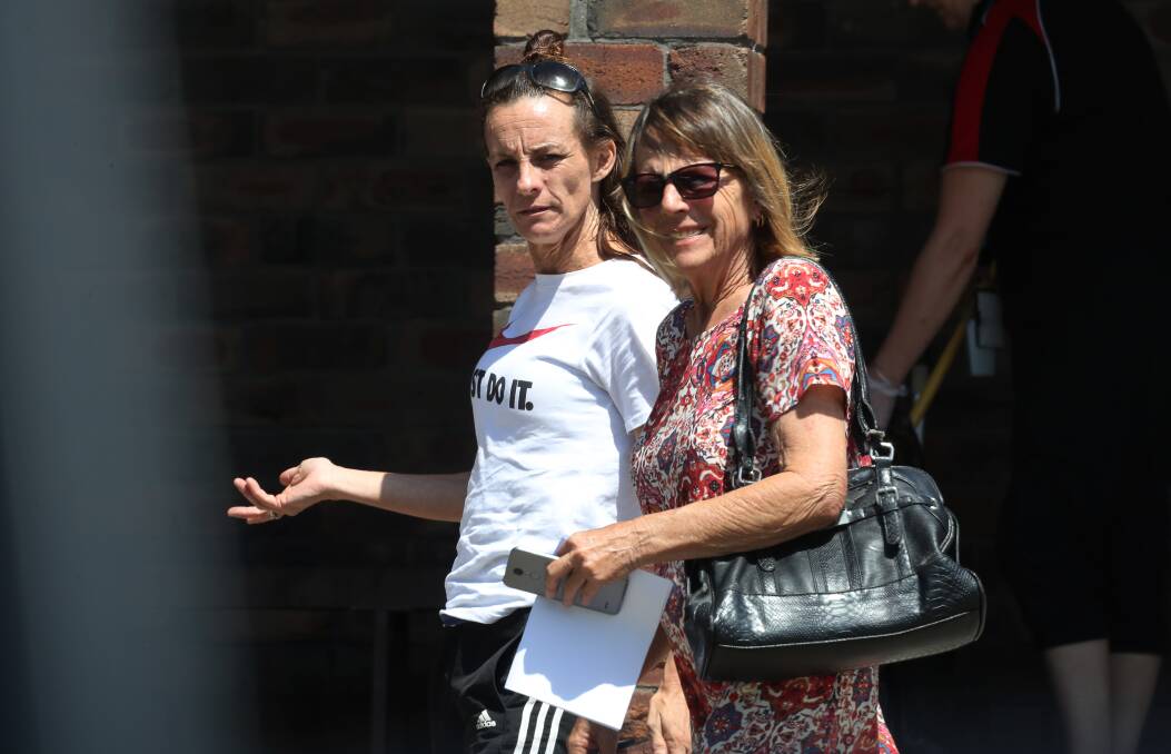 Rebecca Cooper (left) leaves court with a supporter after her sentencing.